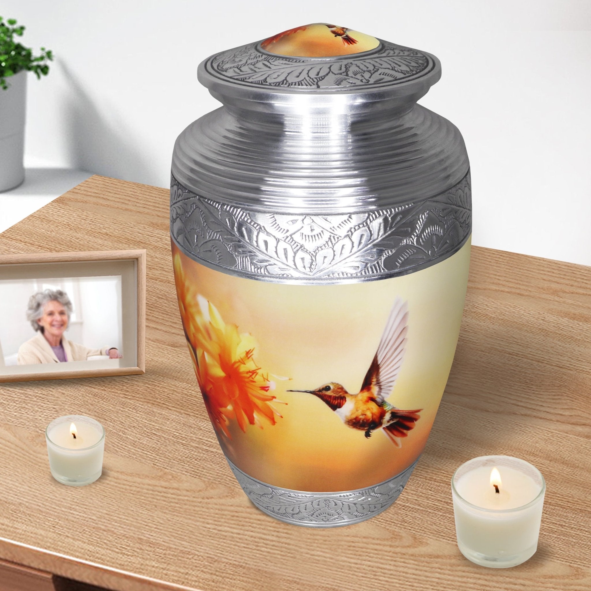 Yellow hummingbird urn with ornate silver edging, metal adult memorial vessel with candles for dear father