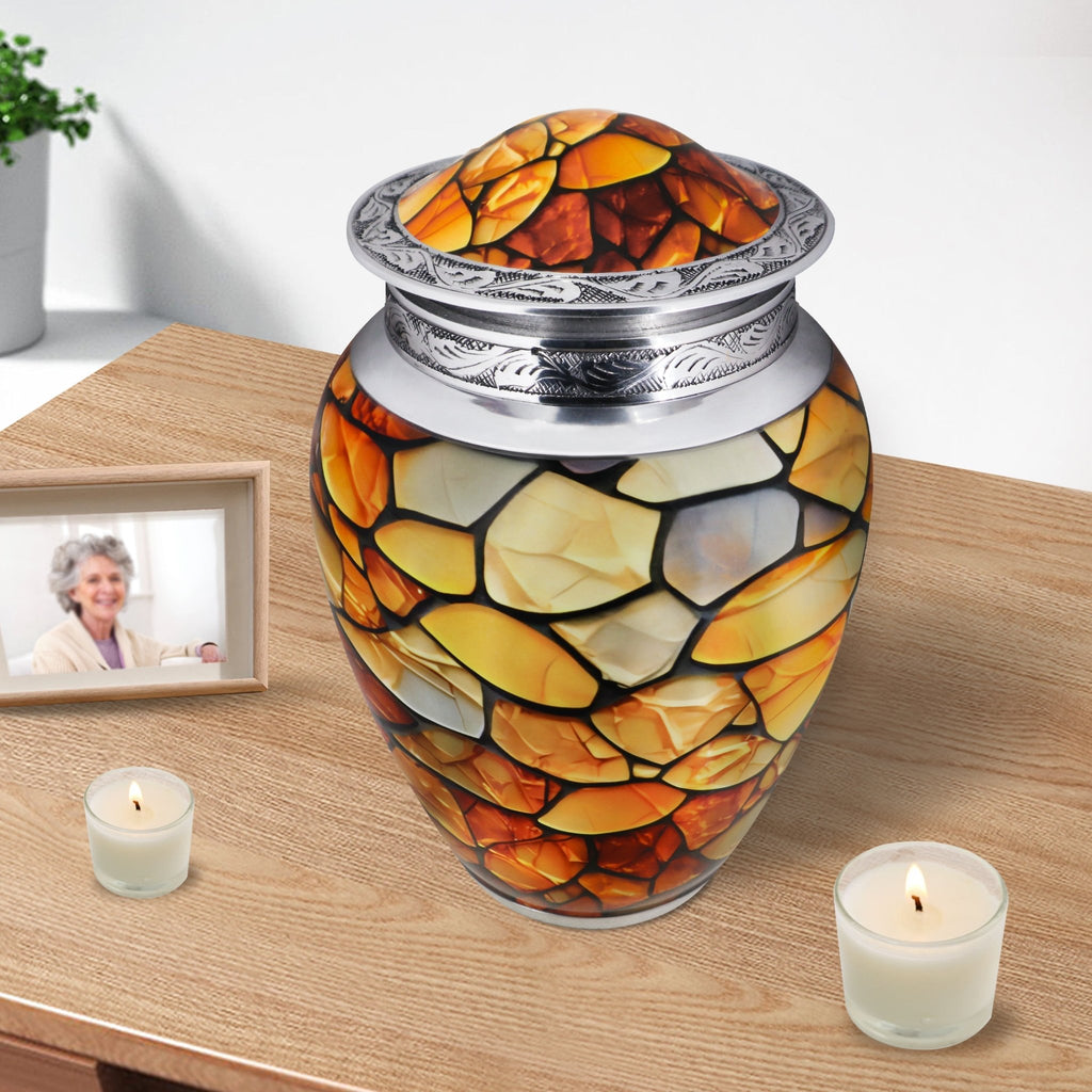 Funeral urn resting beside candles, amber stone artwork bringing comfort while remembering a cherished mother