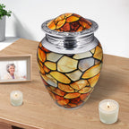 Funeral urn resting beside candles, amber stone artwork bringing comfort while remembering a cherished mother