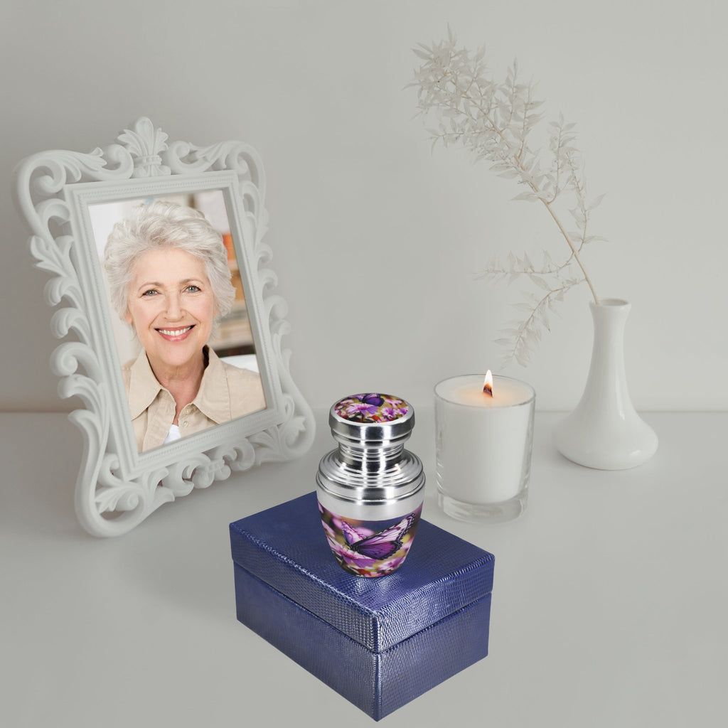 Purple urns for human ashes beside a memorial photo, honoring a beloved wife with lasting remembrance
