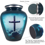 Metal cremation urn with turquoise cross artwork and secure threaded top lid shown in detailed close-up