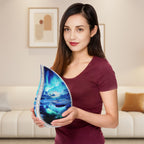 Woman holding cosmic aurora teardrop funeral urn inside bright living room to show its full size for adult remembrance