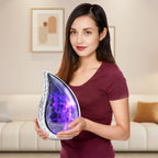 Woman holding a purple cosmic galaxy teardrop urn, showing the full-size adult memorial urn for scale