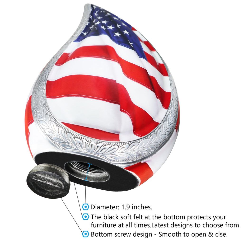 Close up of patriotic military ashes in an urn metal tear drop with secure screw lid and engraved silver edge