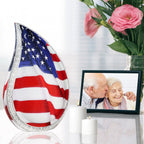 Memorial urns for ashes US flag and military urn on reflective table with family photo for military mother