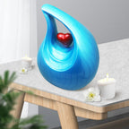 Turquoise decorative urn placed on fireplace mantel, elegant columbarium urn suitable for home display and niche use