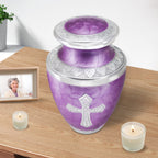 Urns for cremated remains with elegant purple scales, memorial piece for wife displayed beside candle and cherished portrait