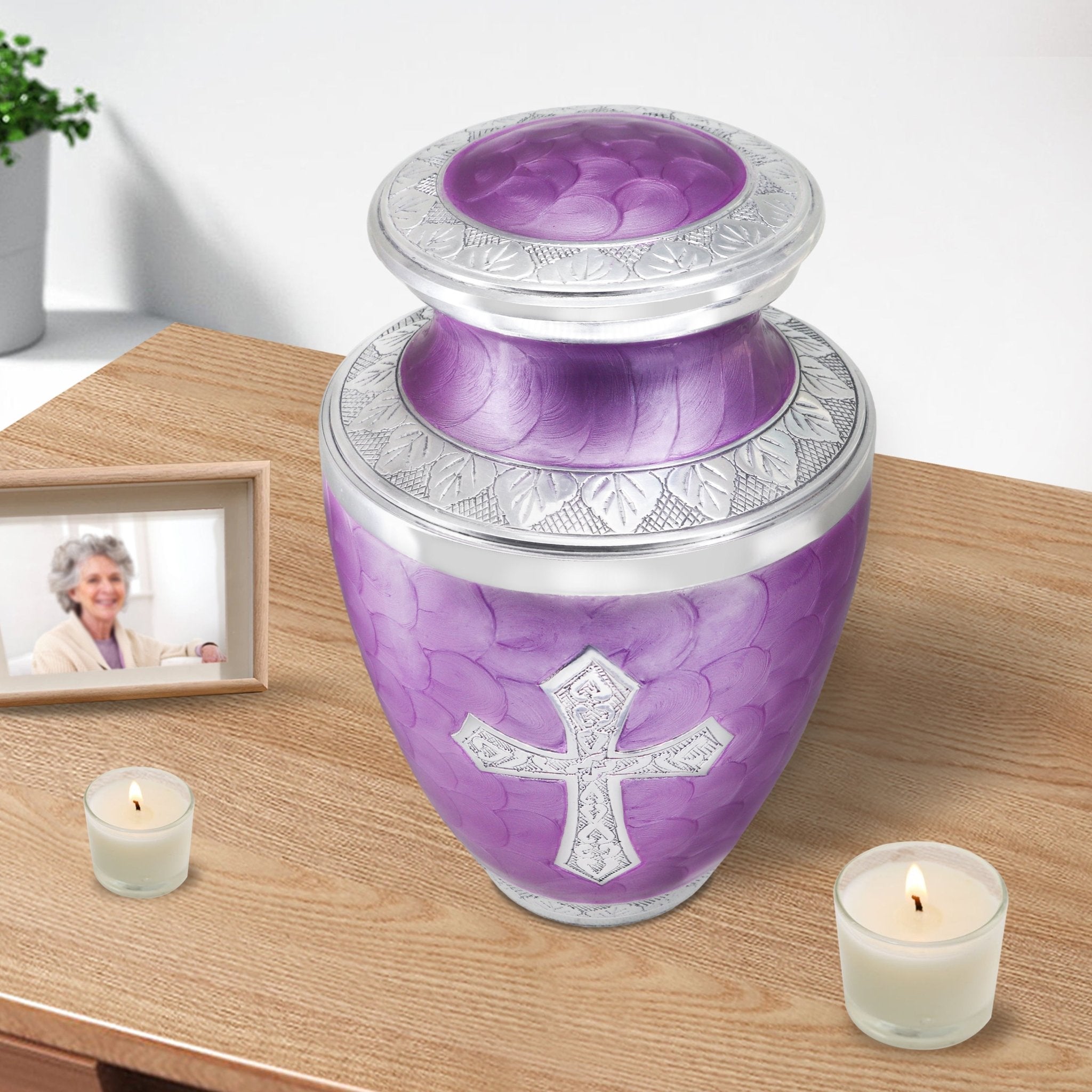 Urns for cremated remains with elegant purple scales, memorial piece for wife displayed beside candle and cherished portrait