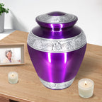 Rich purple silver trimmed metal vessel holding ashes in an urn, quiet table memorial display dedicated to dear father