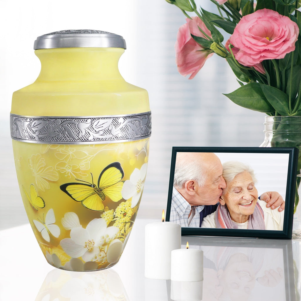 Butterfly urns for human ashes beside family photo and roses, graceful memorial for wife and cherished memories