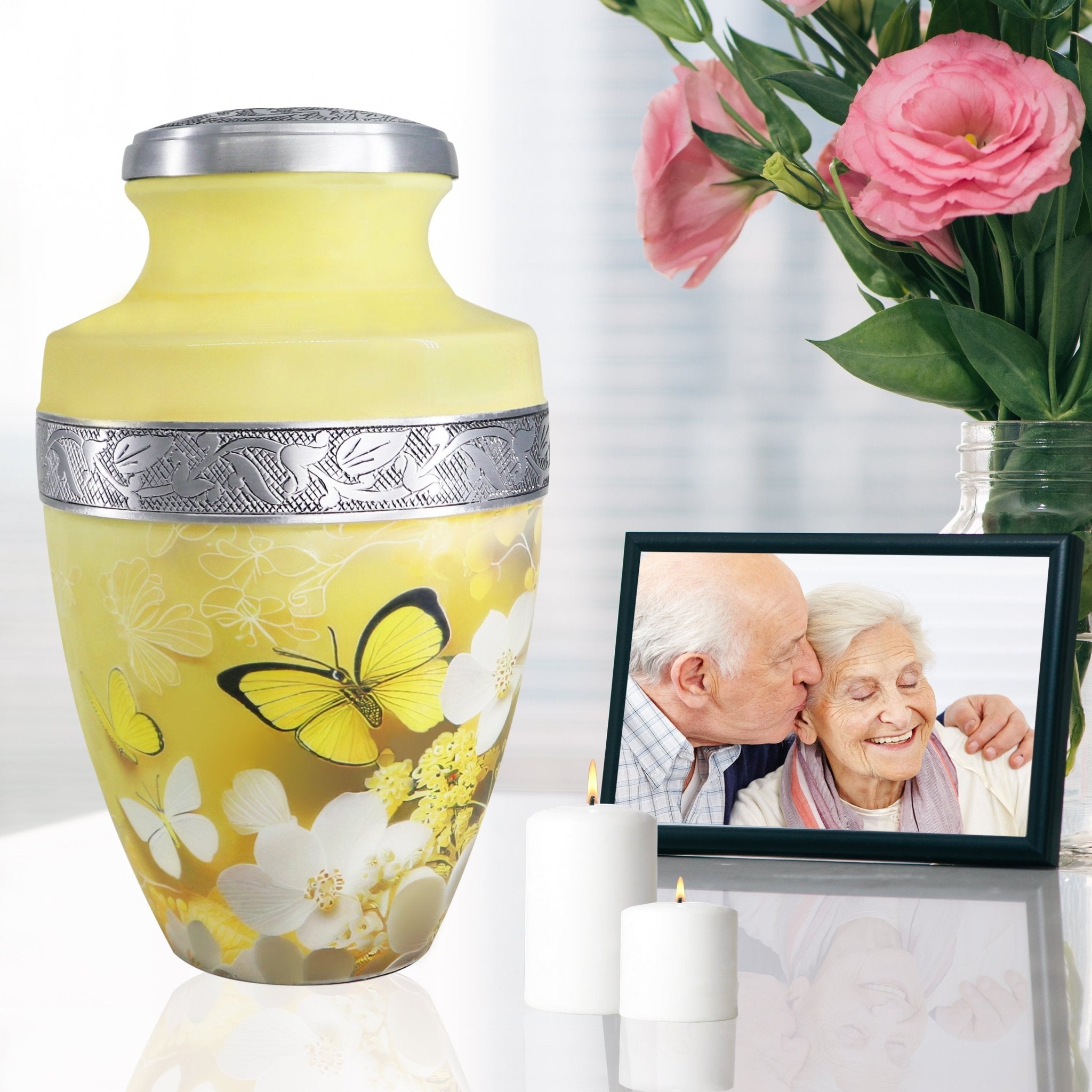 Butterfly urns for human ashes beside family photo and roses, graceful memorial for wife and cherished memories
