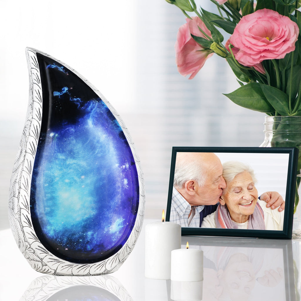 Cosmic star night urn by framed family photo with pink roses, heartfelt remembrance vessel for cherished loved one remains