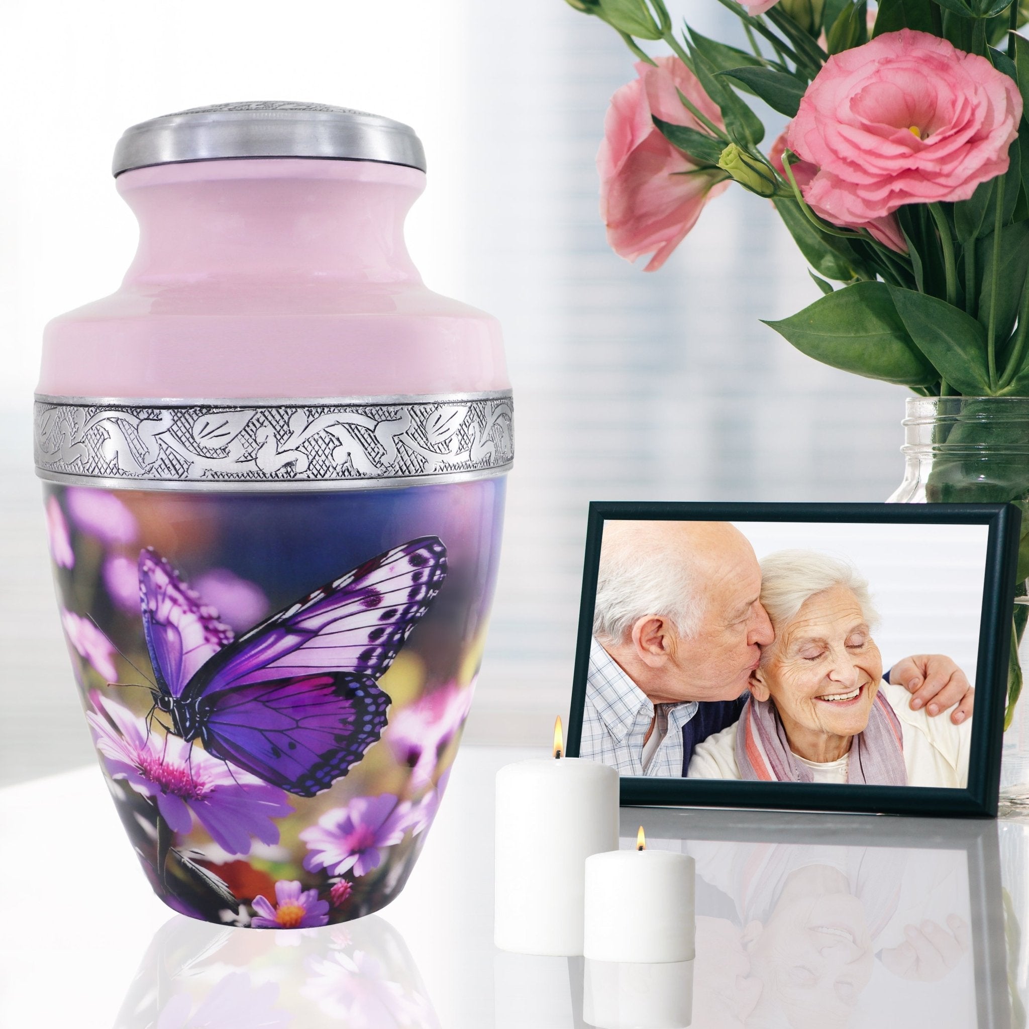 Butterfly urns for human ashes beside family photo and roses, graceful tribute for wife with floral elegance
