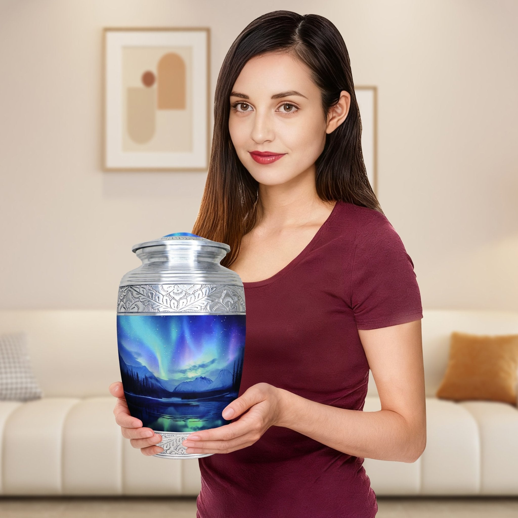 Woman holding a full-size Northern Lights urn for cremated remains, showing the adult memorial urn for scale