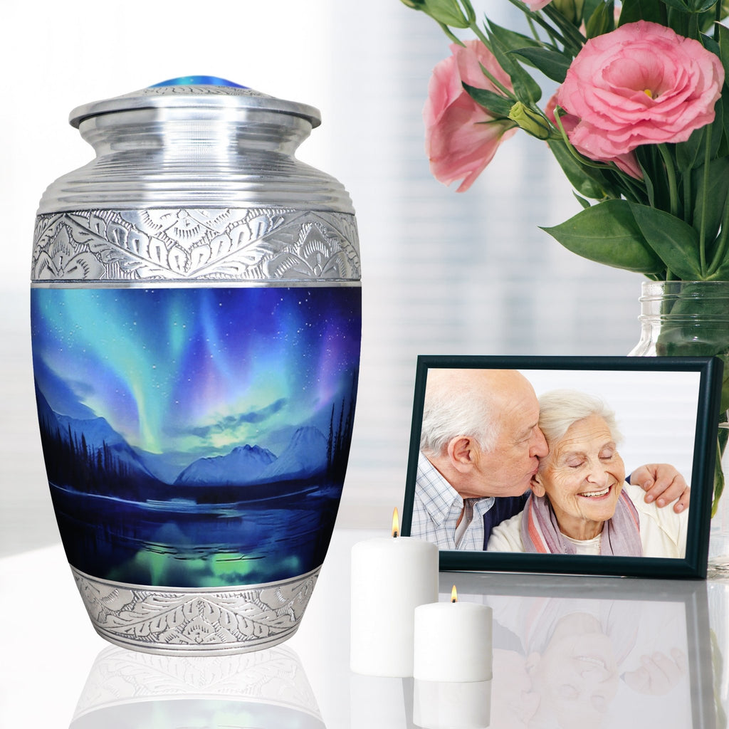 Aurora Borealis funeral urn displayed beside a family memorial portrait and pink flowers for peaceful remembrance