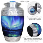 Metal cremation urn with turquoise Aurora Borealis artwork and secure threaded lid shown in detailed close-up