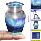 Mini cremation urn with Northern Lights design, compact 3-inch size guide and secure screw-top lid