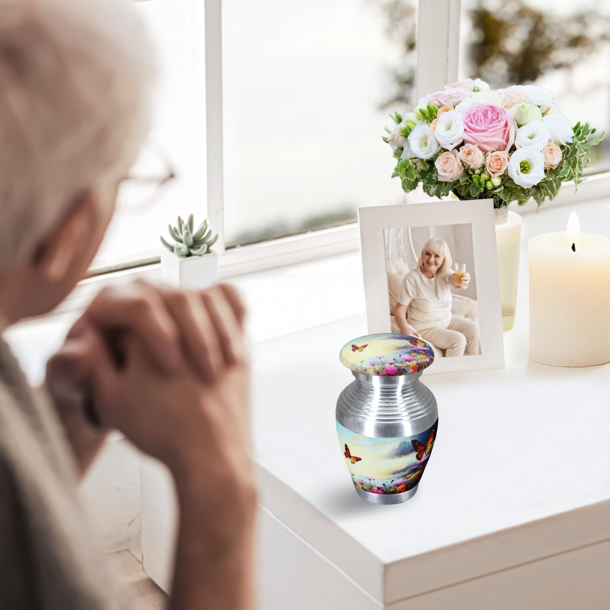 Small urns for ashes with sky butterfly flower art, mini keepsake urn on windowsill, elderly lady mourning by memorial decor