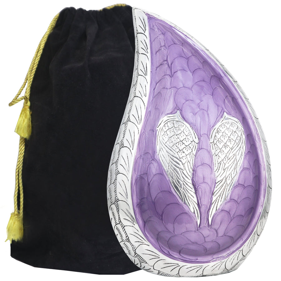 Angel wing urn for ashes in purple with sculptural tear drop design, silver wings and black velvet storage bag