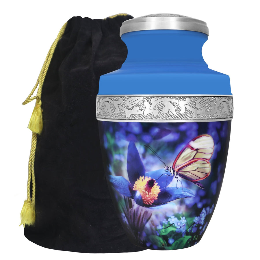 Blue butterfly floral urn for ashes with vivid garden artwork, silver engraved band and black storage bag