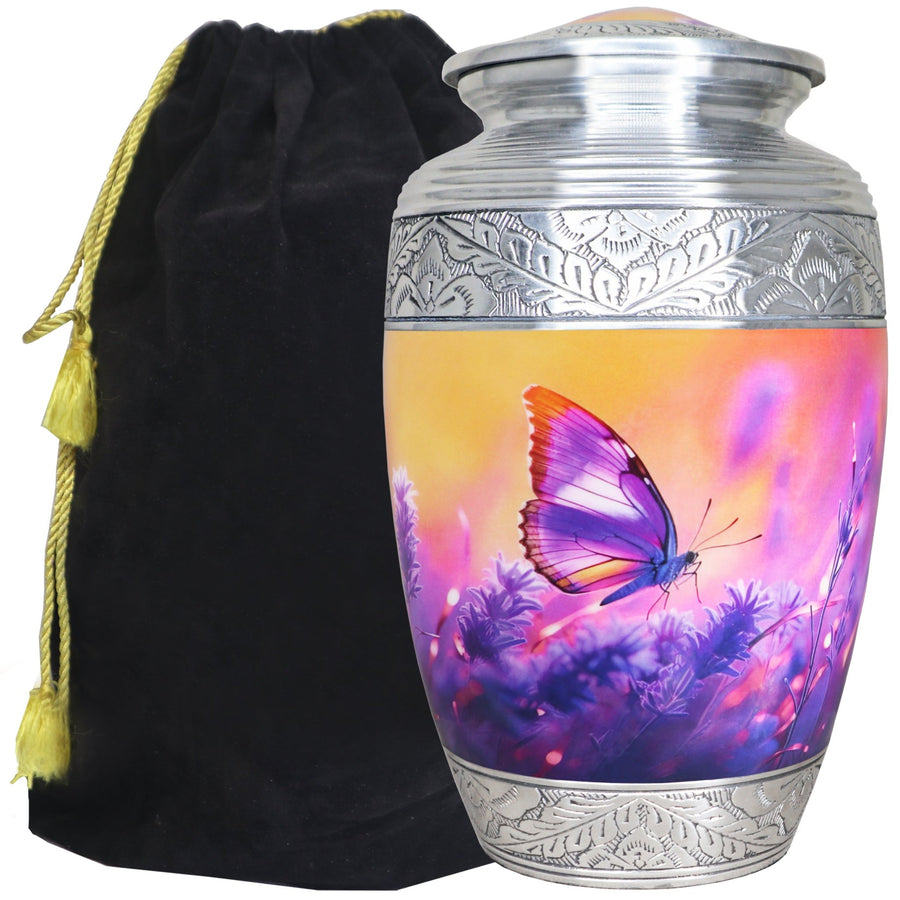 Purple urn with butterflies and lavender artwork beside a velvet bag, full-size memorial with engraved silver bands