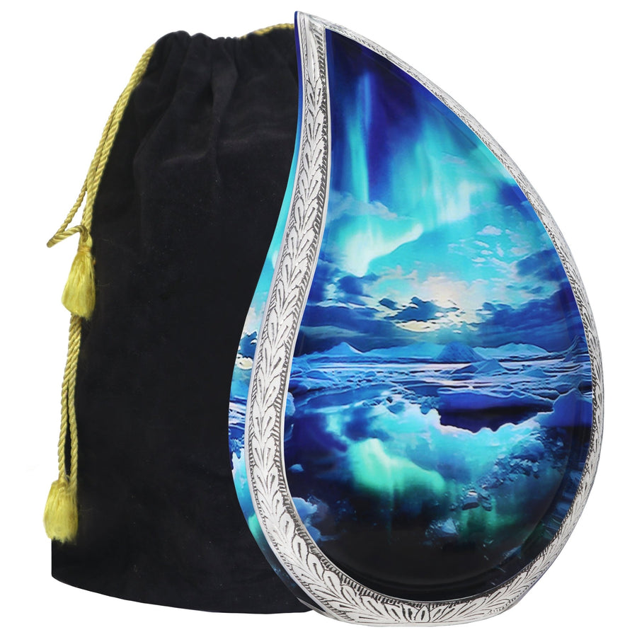 Turquoise urn with Aurora Borealis teardrop artwork, engraved silver trim and a black velvet storage bag