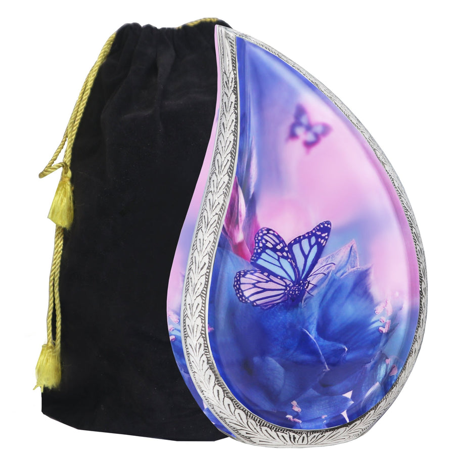 Blue urns for human ashes in butterfly teardrop design with engraved silver trim and black velvet storage bag