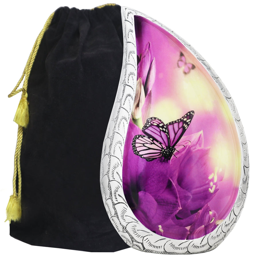 Purple cremation urns with butterfly tear drop artwork, engraved silver trim and a black velvet storage bag