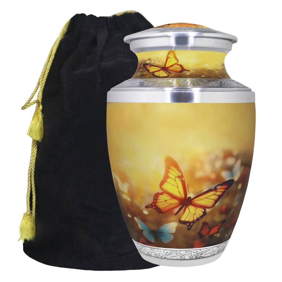 Yellow butterfly cremation urn for ashes with floral artwork, silver engraved bands and black velvet storage bag