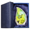 Tiny brass keepsake urn for ashes with yellow butterfly artwork presented in a padded blue memorial gift box