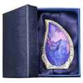 Brass keepsake urn for ashes in a blue butterfly teardrop design, presented in a padded blue gift box