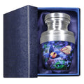Mini aluminum keepsake urn for ashes with blue butterfly floral artwork presented in a padded blue gift box