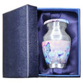 Mini keepsake urn for ashes with blue butterfly artwork presented in a padded gift box for family remembrance
