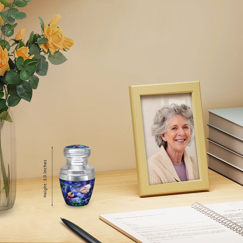 Tiny urns for ashes with blue butterflies near a family portrait, cremation containers for a cherished dad