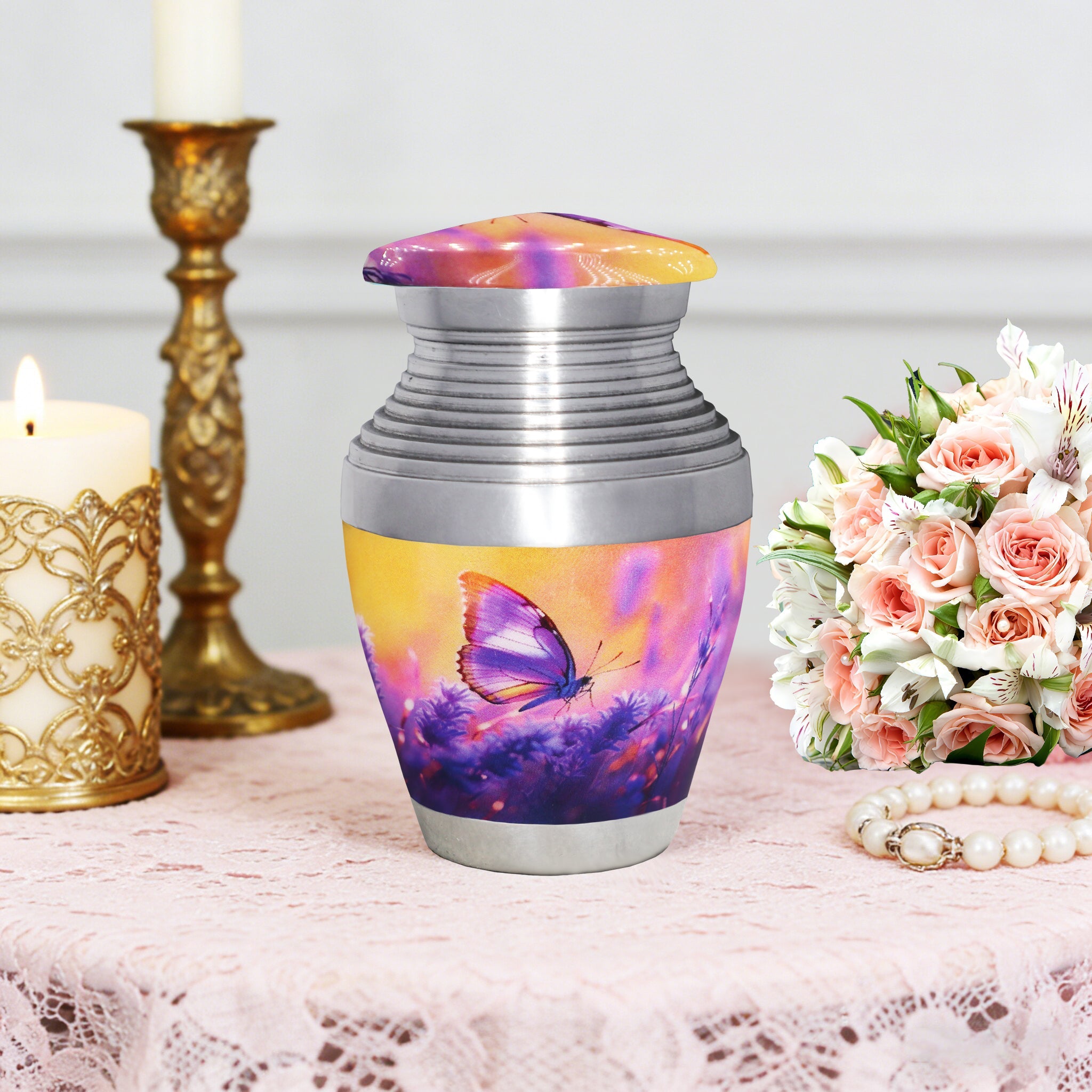 Cremation containers with purple lavender butterflies pattern, small memorial urn, table display with flowers and candle